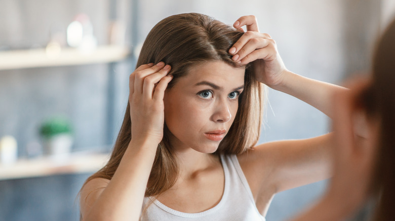 Woman concerned with her hair