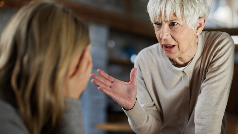 Angry woman criticizing adult daughter