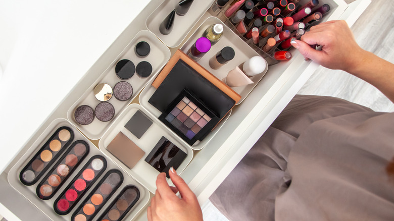 A drawer filled with makeup