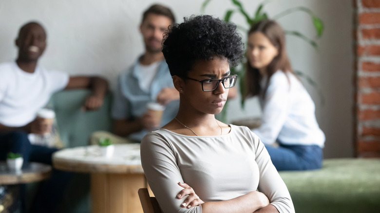 Woman looking worried with others