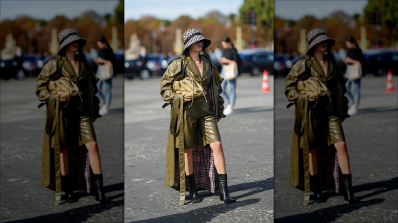 woman wearing bermuda shorts and coat