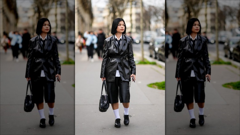 woman wearing leather Bermuda shorts