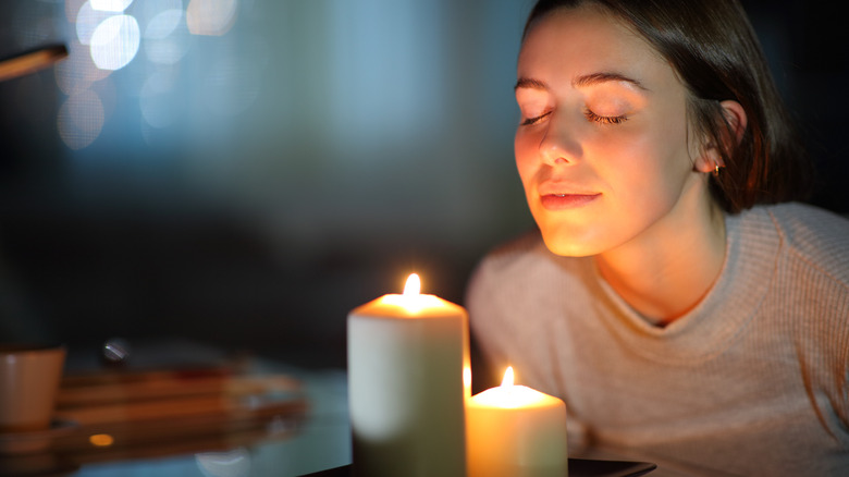 Woman basks in candlelight 