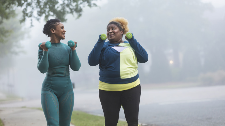 Women walking with hand weights