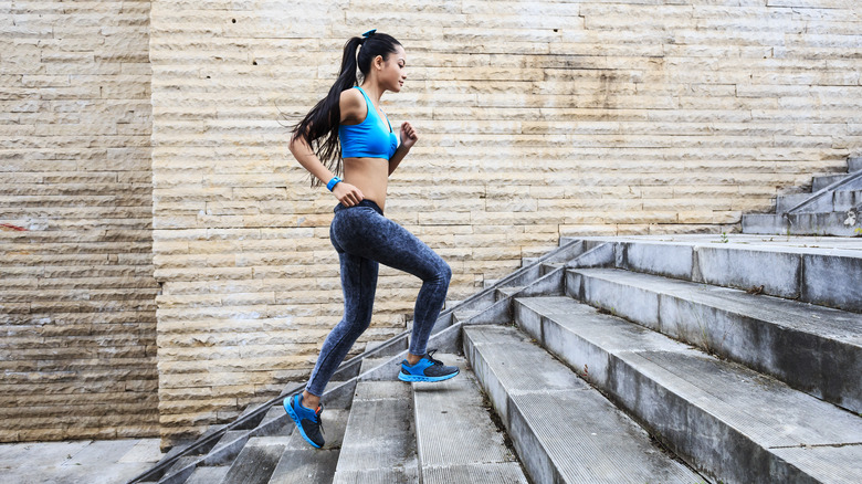 Woman walking up stairs