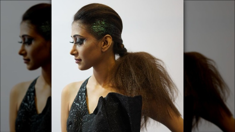 Model with bouffant ponytail with glitter