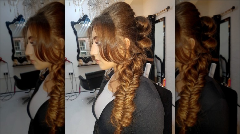 Model with fishtail-braided bouffant hairstyle