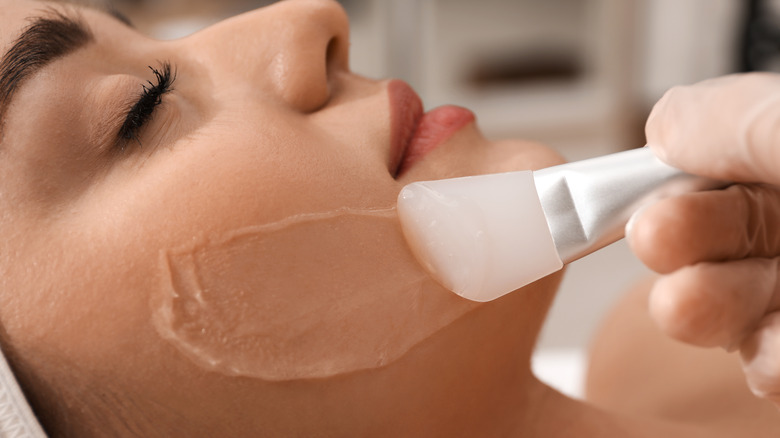 Woman receiving chemical peel