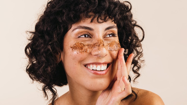 Woman with facial scrub