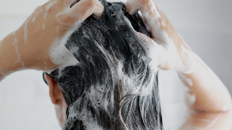 woman using shampoo