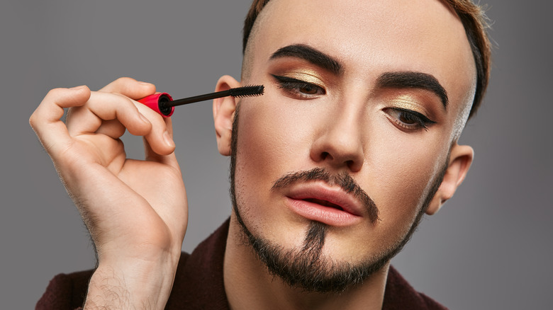 Person applying mascara