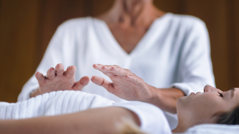 Reiki healer hands treatment