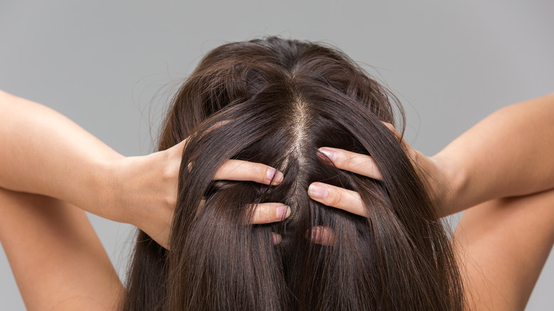 Woman massaging scalp 