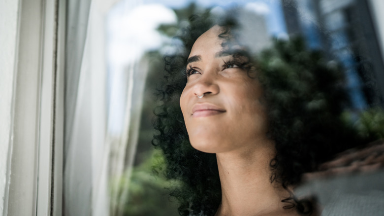 Woman looking outside