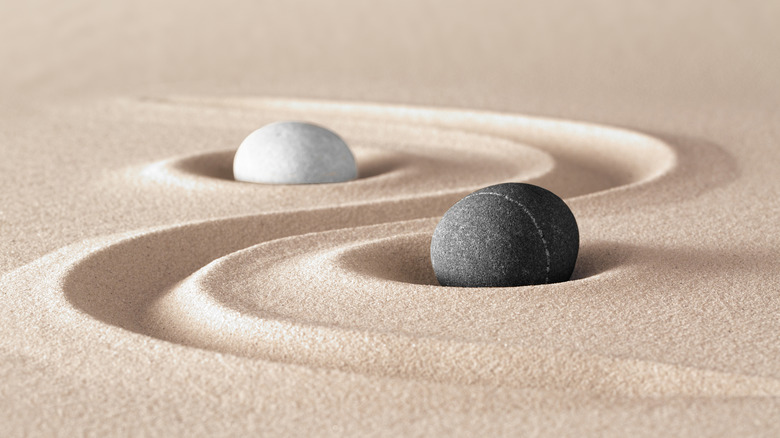 Yin and yang symbols in sand