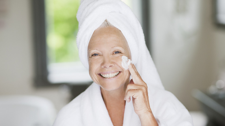 woman applying skincare