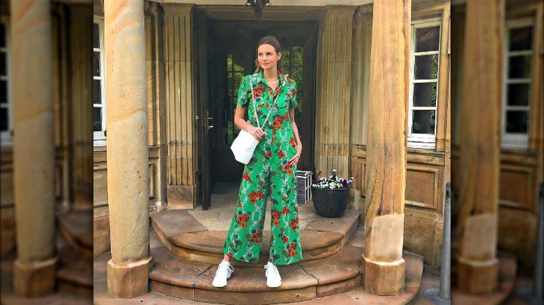 green jumpsuit with red flowers