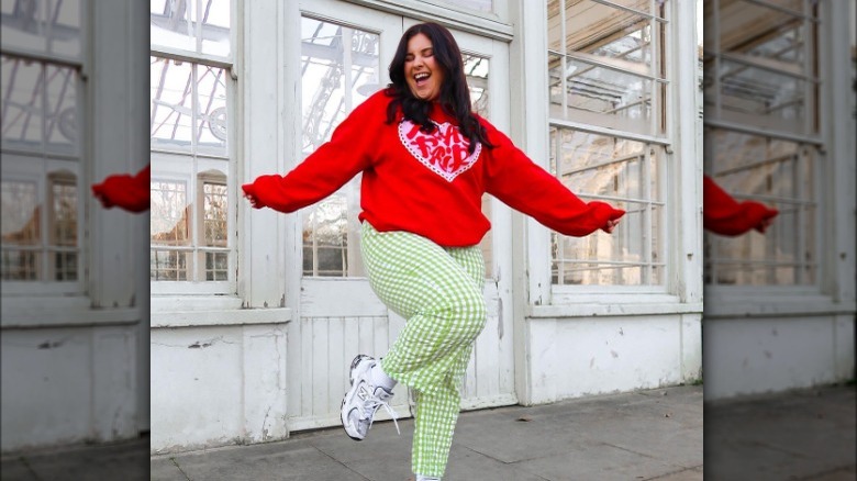 Woman wearing green checkered pants