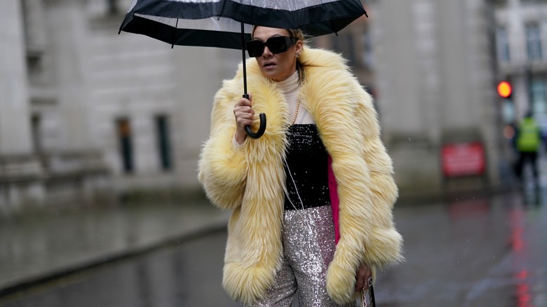 woman wearing coat and tube top