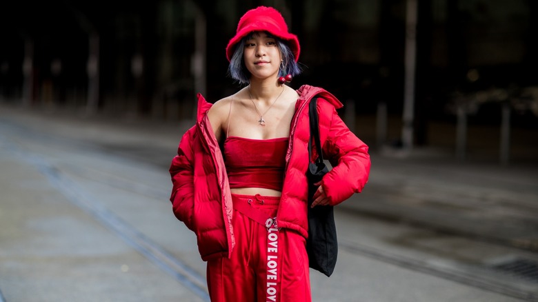 woman wearing red puffer jacket