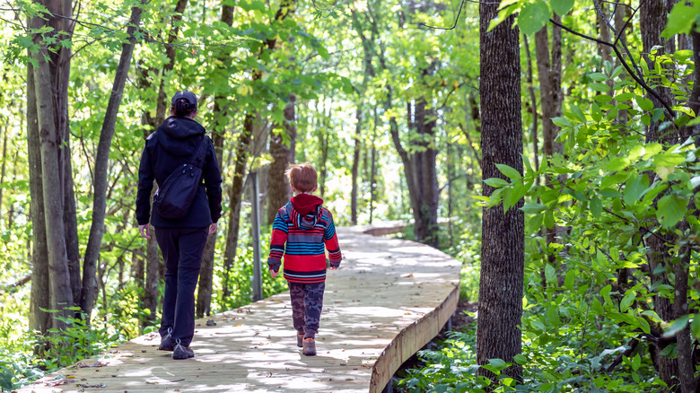 Woman and child on winding footpath