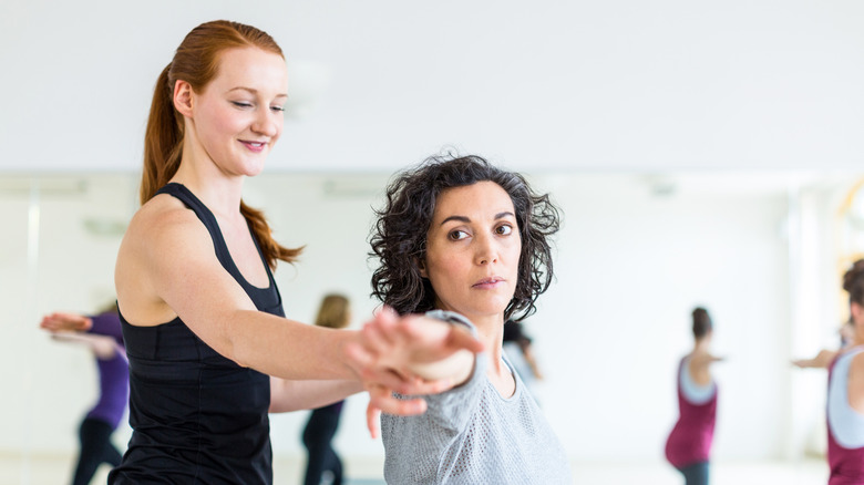 Woman tracing yoga class