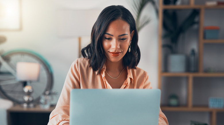 Woman taking quiz on laptop