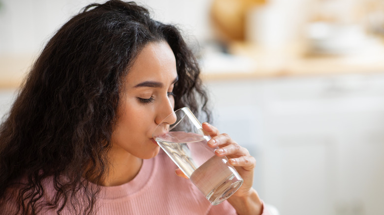 Woman drinking glass of water