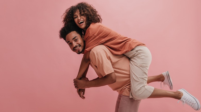 Couple giving a piggyback ride 