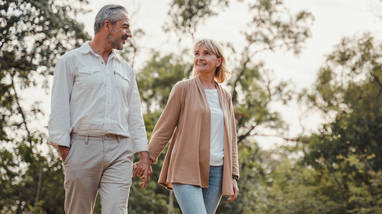 Couple walking holding hands 