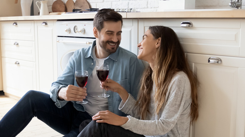 Couple talking on the kitchen floor 