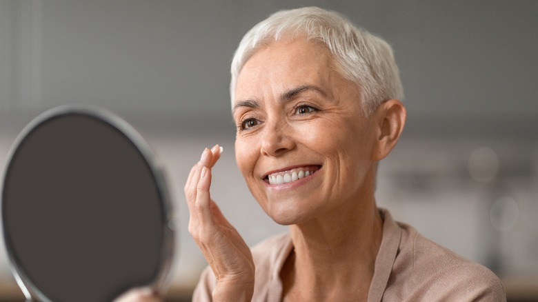 Woman with white hair round face