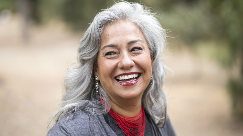 Smiling Latinx woman with gray hair