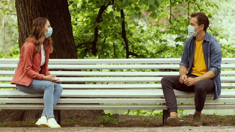 outdoor date man woman wearing masks