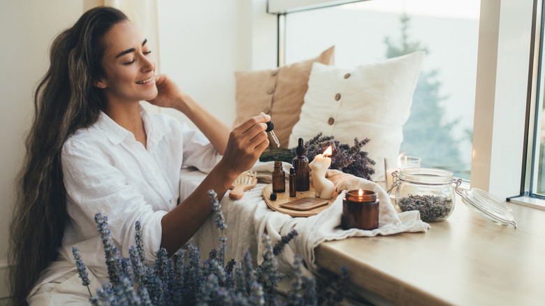 Woman with product bottles