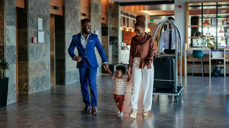 family walking through resort lobby