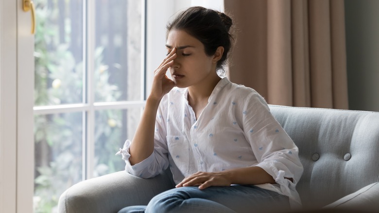 Stressed woman on couch