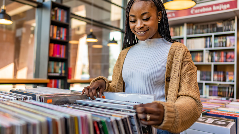 Woman browsing vinyl records in store