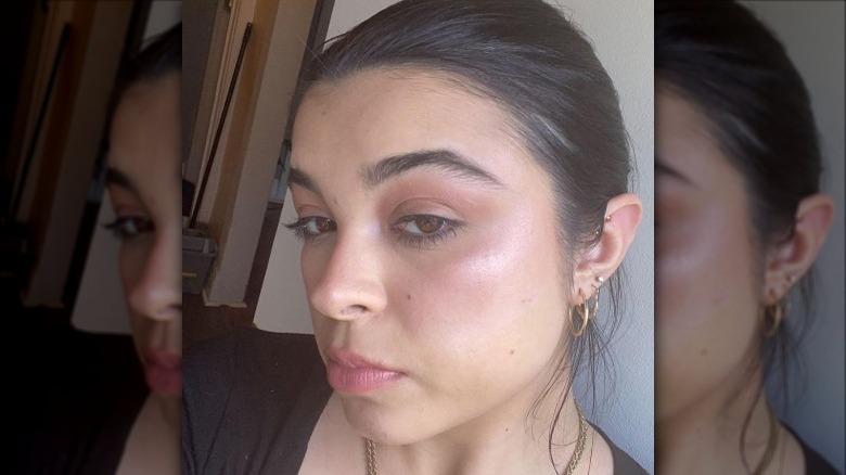 Woman with neutral eyeshadow and purple highlighter