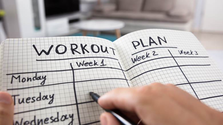 workout plan written in notebook