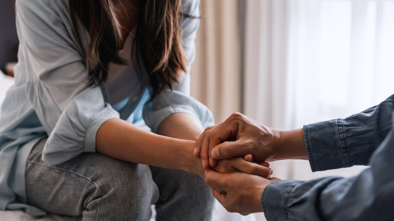 Couple holding hands