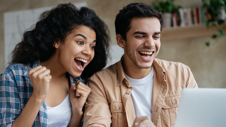 Happy couple with laptop