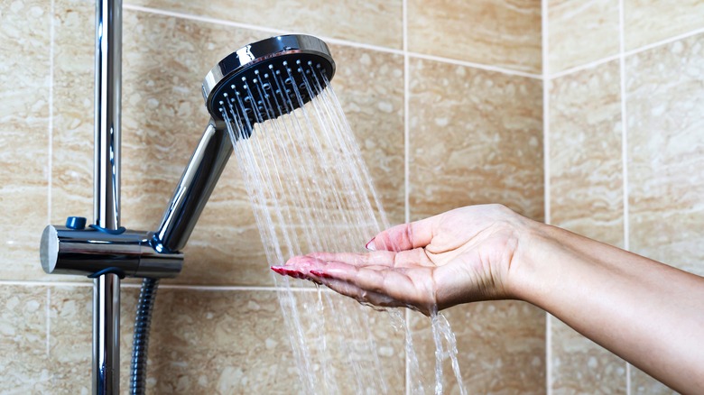 hand in shower water