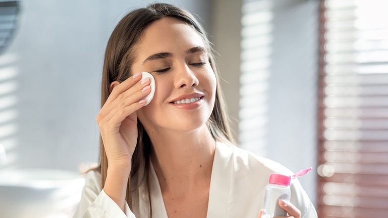 A woman using a toner 