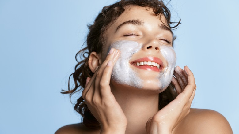 woman using a face scrub