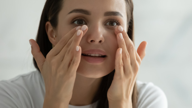 woman doing facial massage