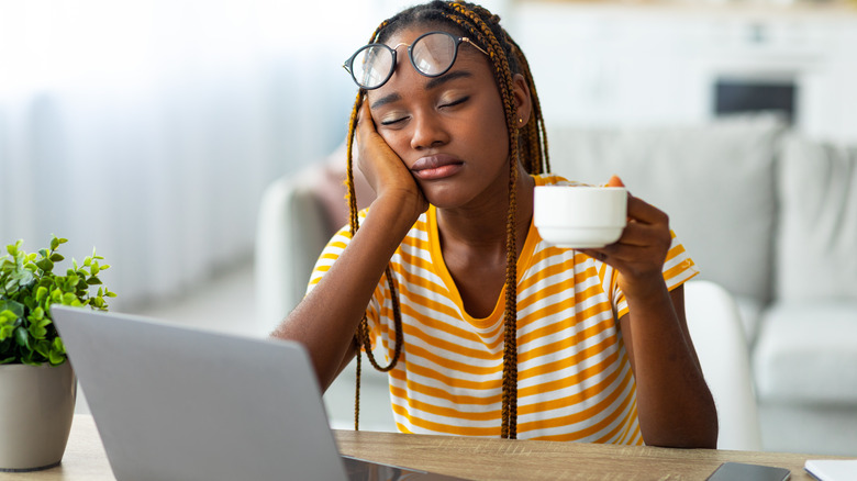 woman tired with coffee