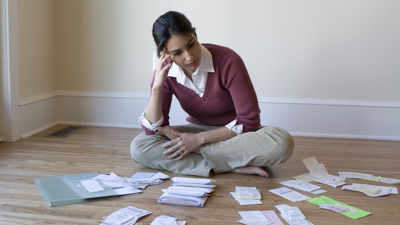 Woman examining receipts and bills