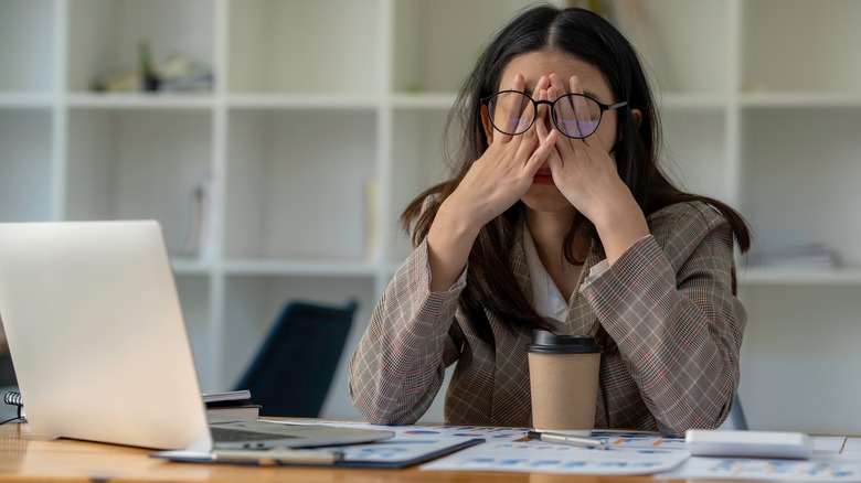 Stressed out woman at desk