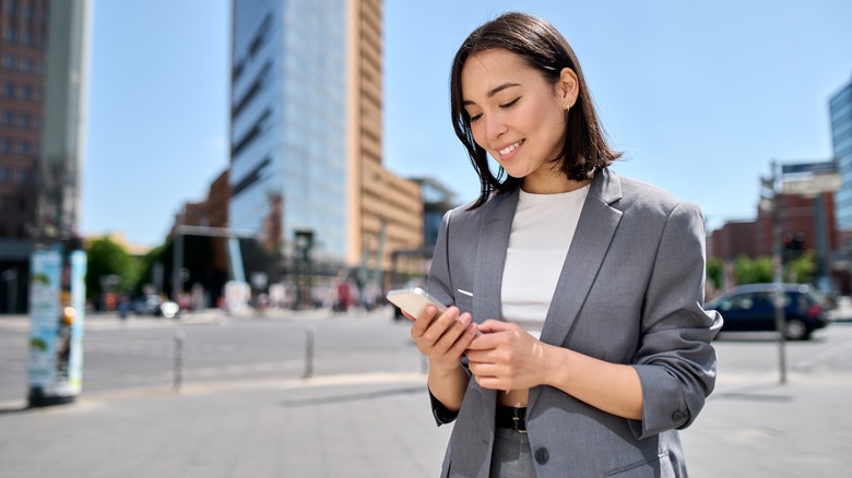 working woman looking at phone